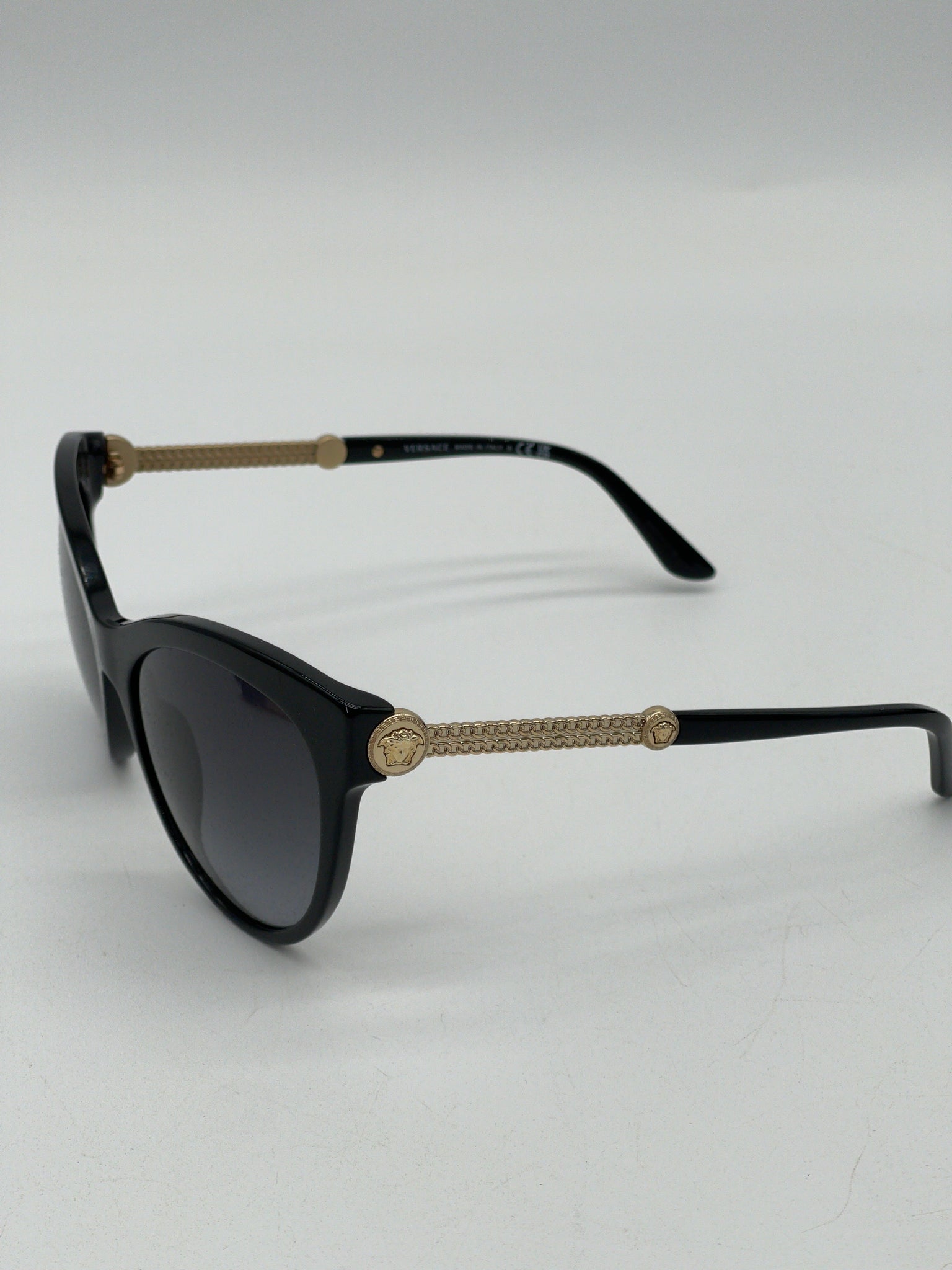 Pre Loved Versace Black Cat eye Chain Medusa Head Sunglasses with gold metal stems with Black Gradient lenses. BV00741214F 100724 P