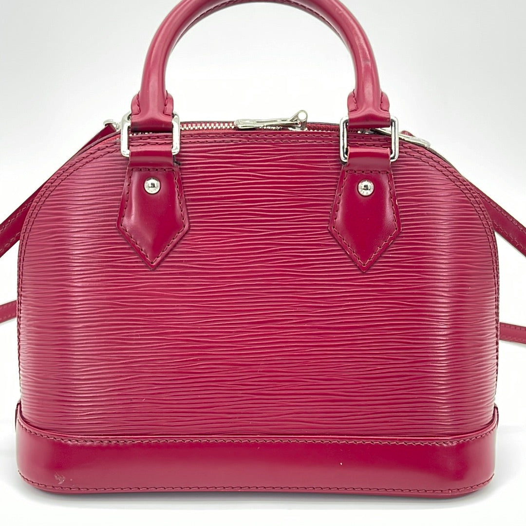 Louis Vuitton alma bb handbag in red,9-inch wide,7.5 inches high,4.3 inches  deep